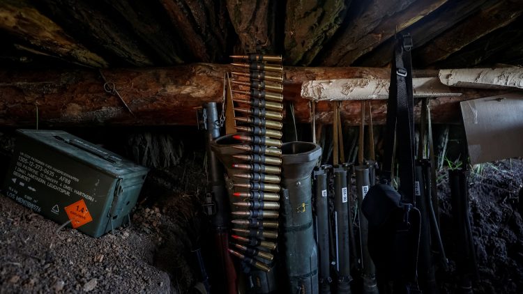 Weapons of Ukrainian service members are seen in a trench at position at a front line in Donetsk region